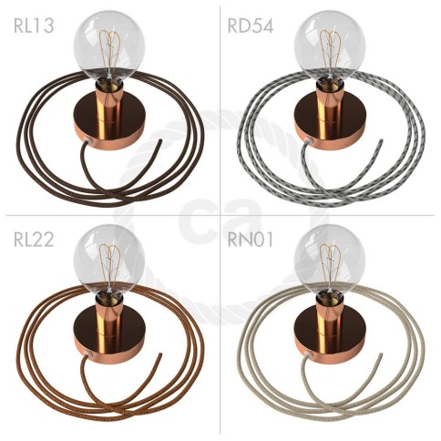 Spostaluce, the coppered metal light source with fabric cable and side holes