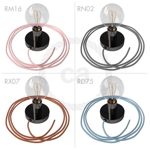 Spostaluce, the black pearl metal light source with fabric cable and side holes
