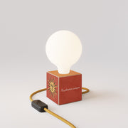 Cubetto table lamp with US plug, "Il sole" porcelain effect globe bulb - Santomanifesto