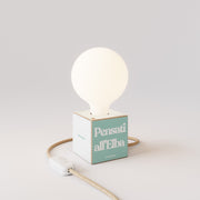 Cubetto table lamp with US plug, "Pensati all’Elba" porcelain effect globe bulb - Tuttapolpa